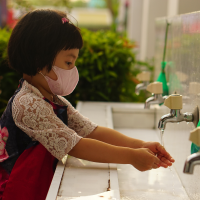 Girl washing her hands